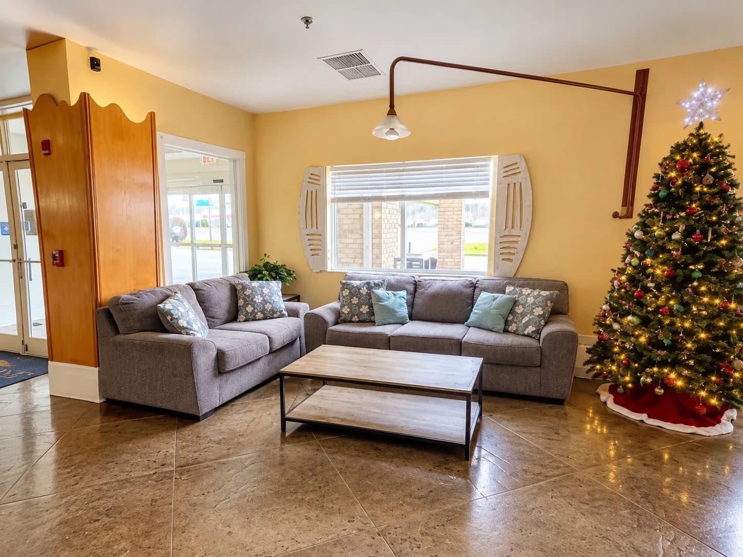 Lobby lounge with sofas and a Christmas tree during the holidays