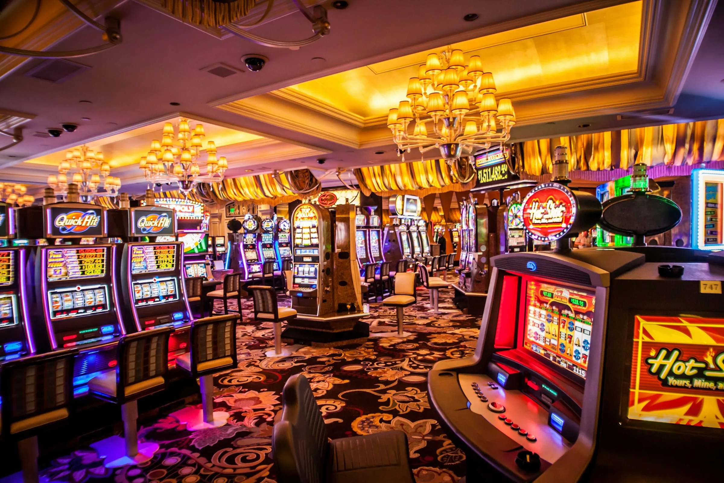 Casino floor lit with slot machines (illustrative)