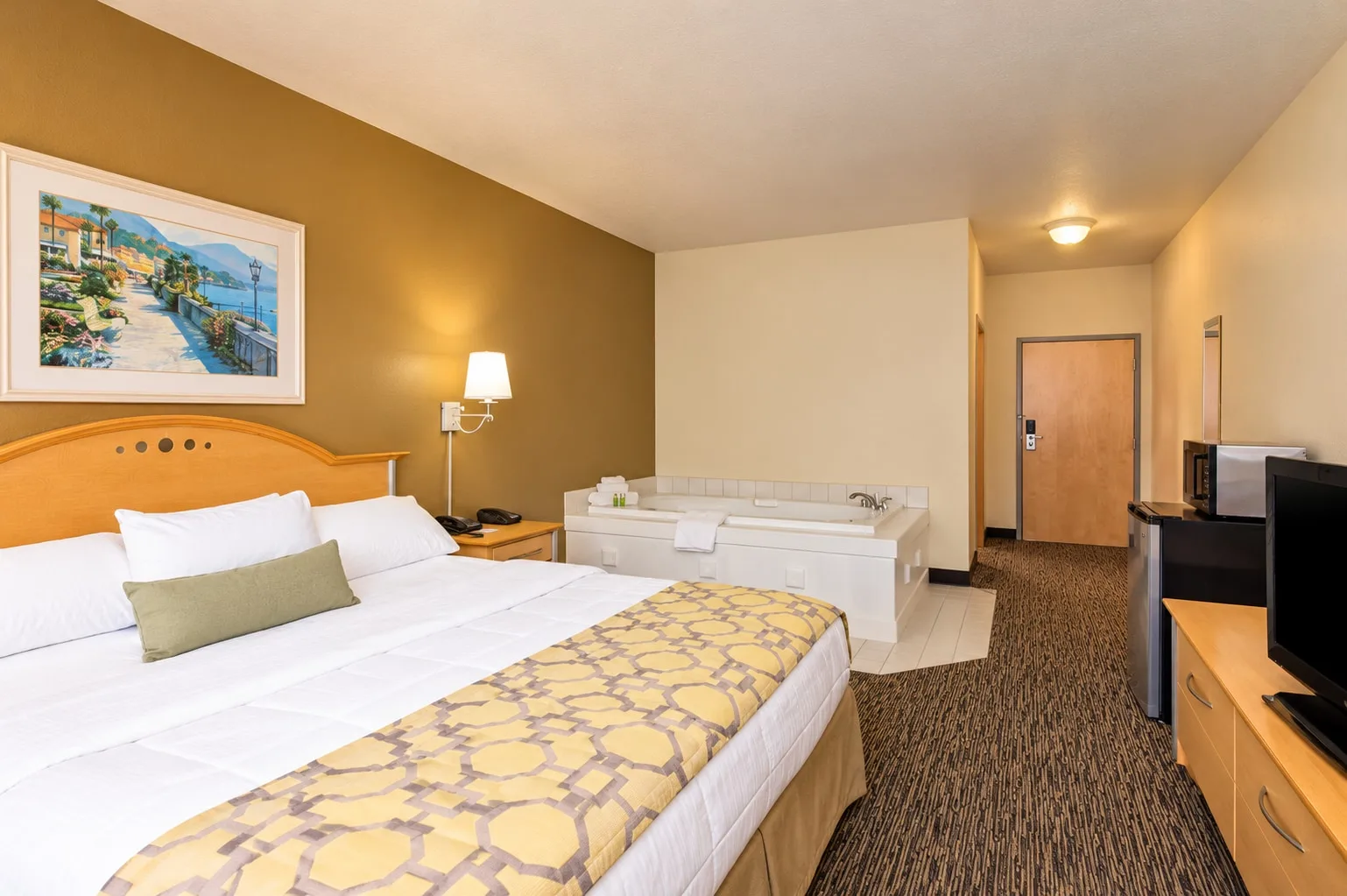 Whirlpool suite with a king bed and an in-room jetted tub