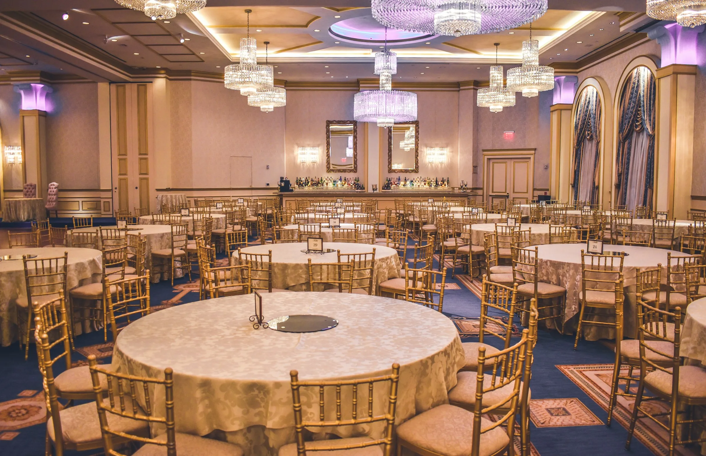 Banquet room set with round tables for a celebration