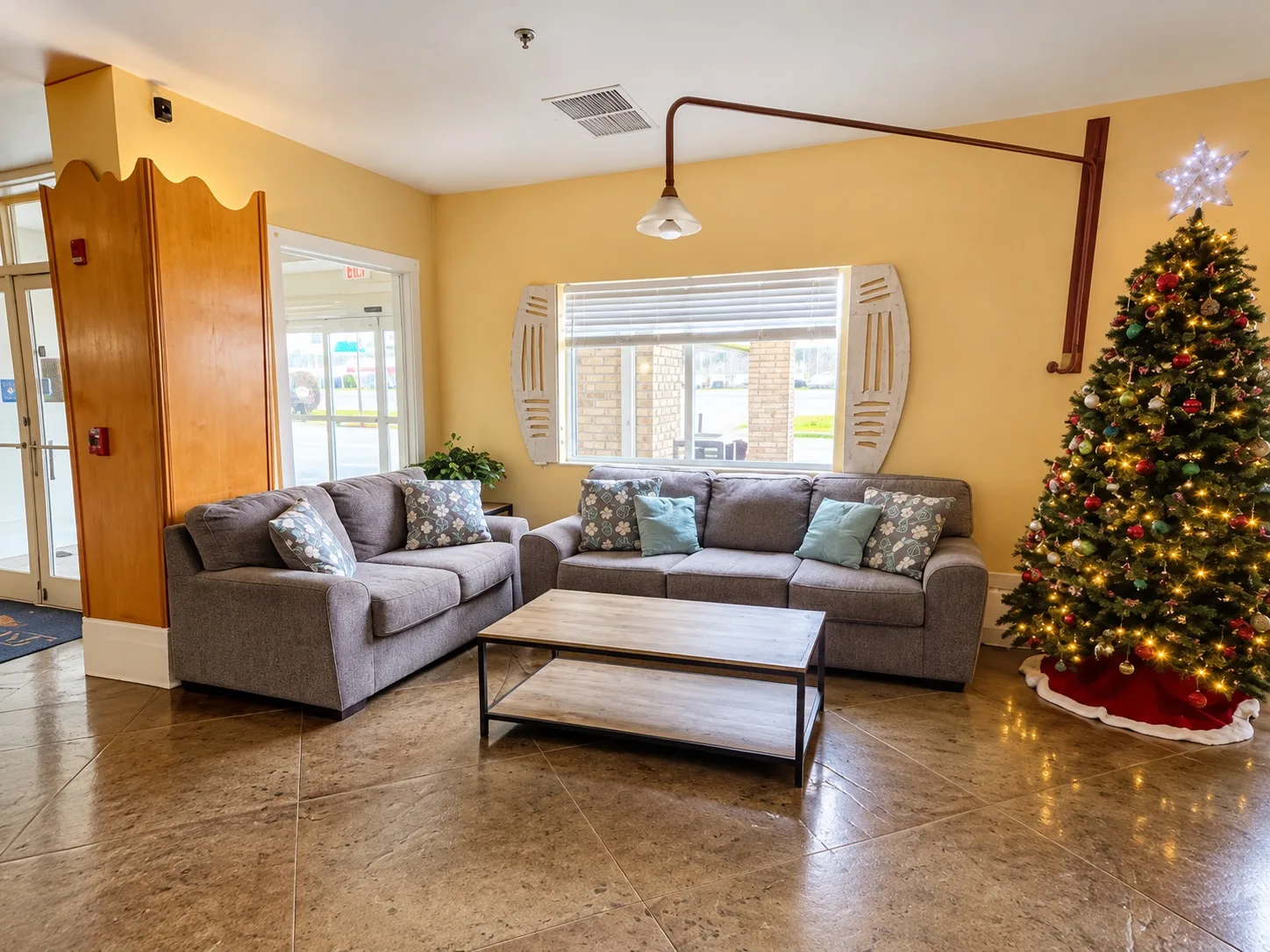 Lobby lounge with sofas and a Christmas tree during the holidays
